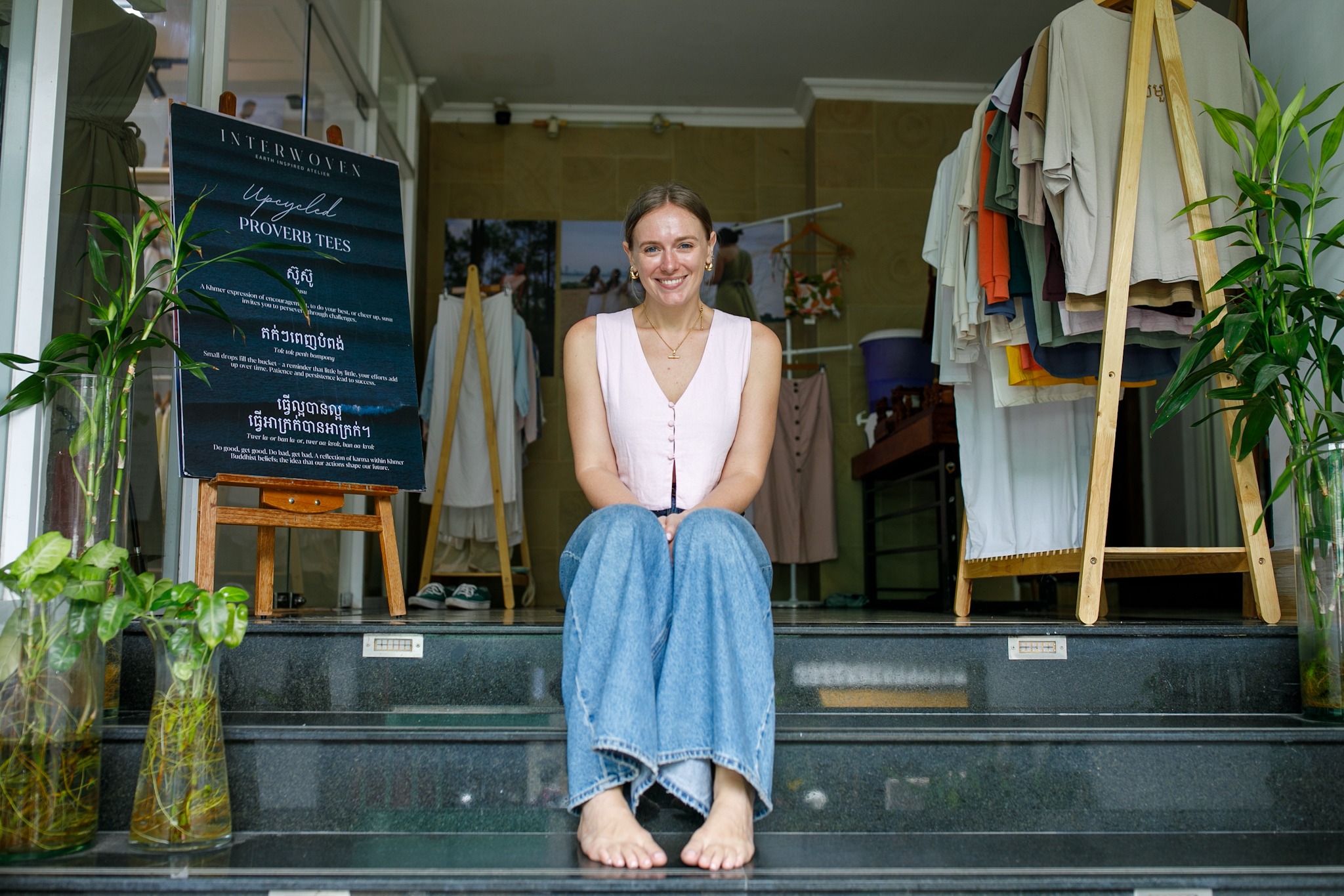 Jess Kalisiak at the entrance to Interwoven Atelier