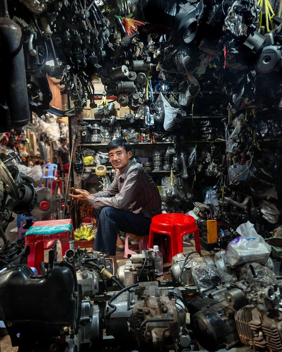 A craftsman surrounded by mechanical parts