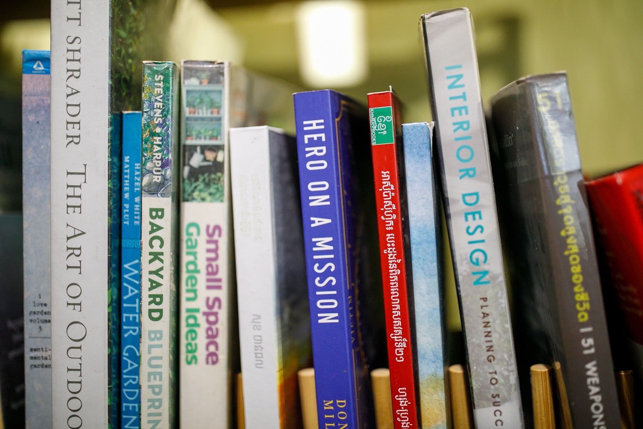 Books about plants, garden design and interior design on a shelf